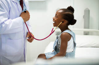 Little girl with doctor